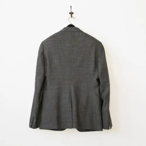 Used suit - back view on hanger