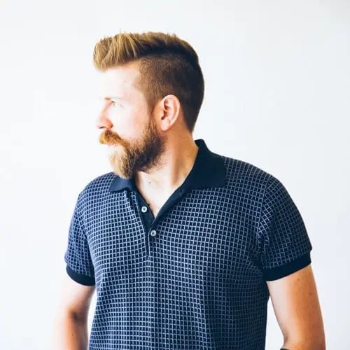 adult man clothed in a knit polo shirt