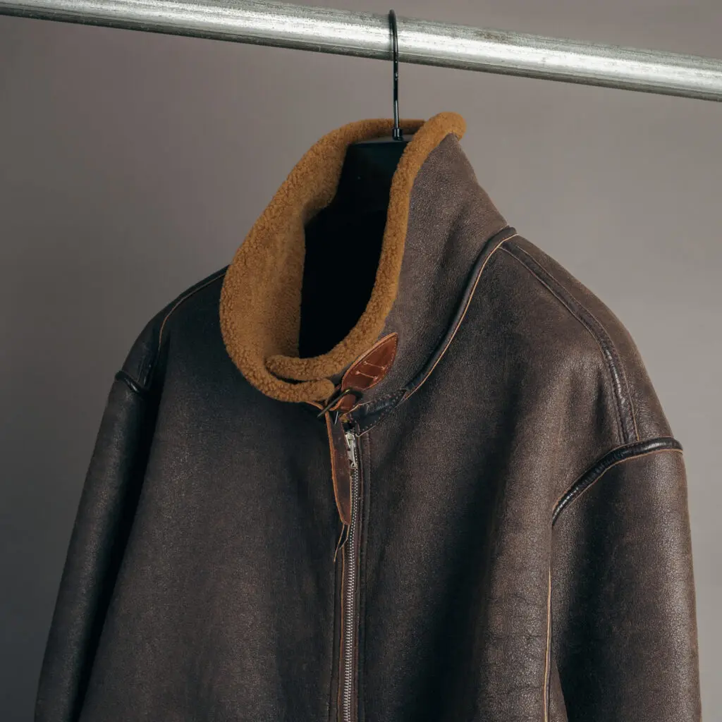 RRL Ralph Lauren D-3 bomber jacket in brown, collar and top, on hanger