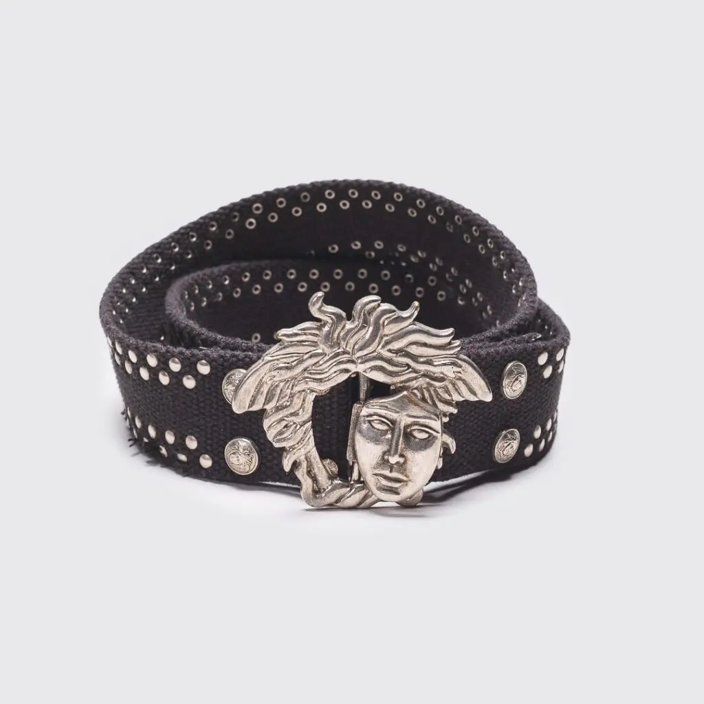 Gianni Versace rare vintage belt with removable interlocking medusa face buckle, cotton canvas strap, black color, studded detail, made in Italy.