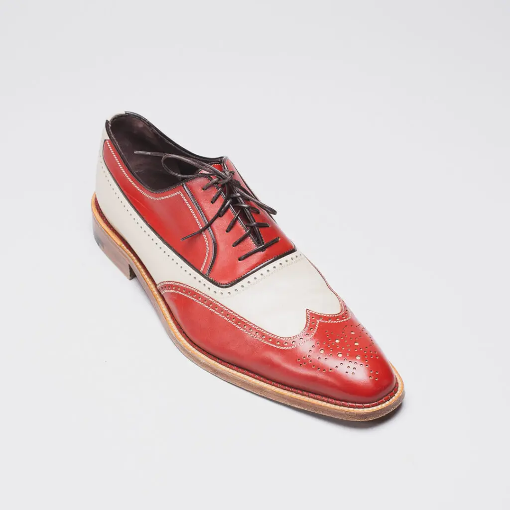 A. Testoni red and white spectator wingtip shoes