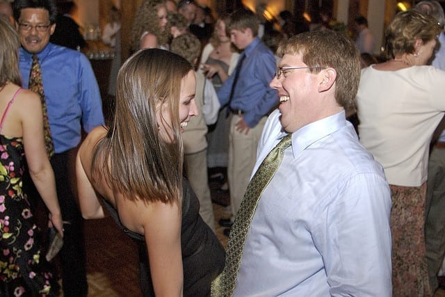 people dancing at wedding attire rules