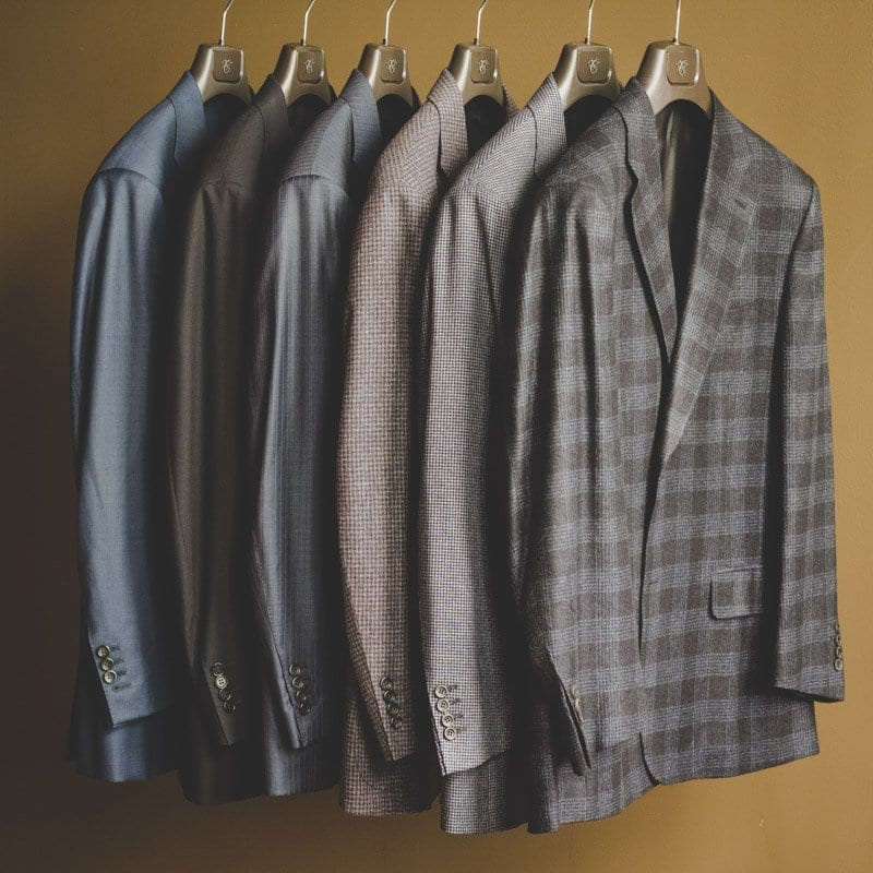rack of suits from canali