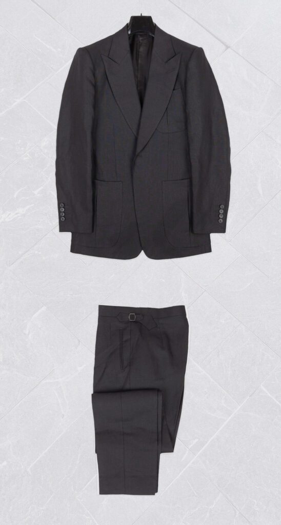 Black 2 piece bespoke suit with wide lapels and side adjuster waistband
